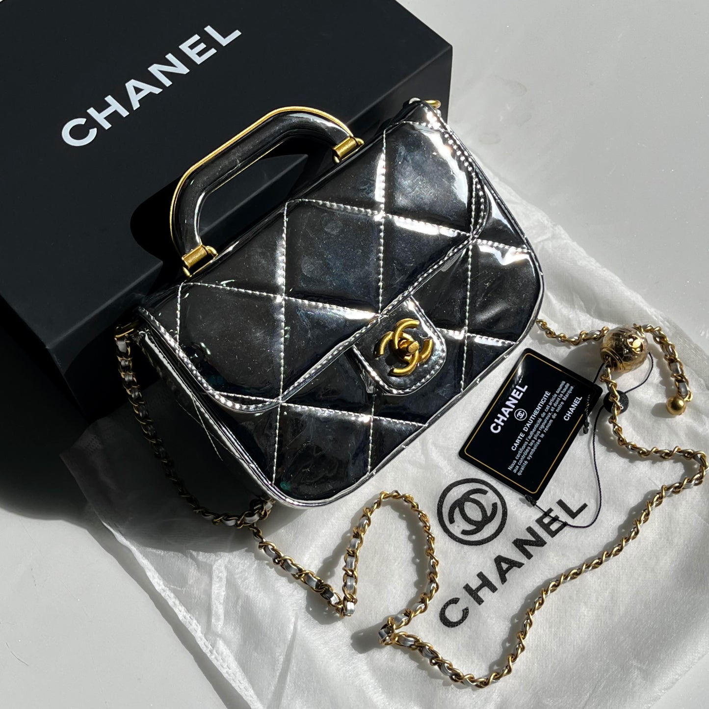 CHANEL | Metallic Mirror Calfskin Large Top Handle Clutch With Chain